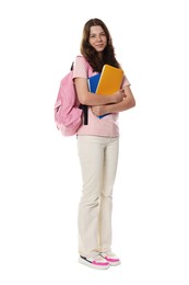 Photo of Cute teenage girl with backpack and notebooks on white background