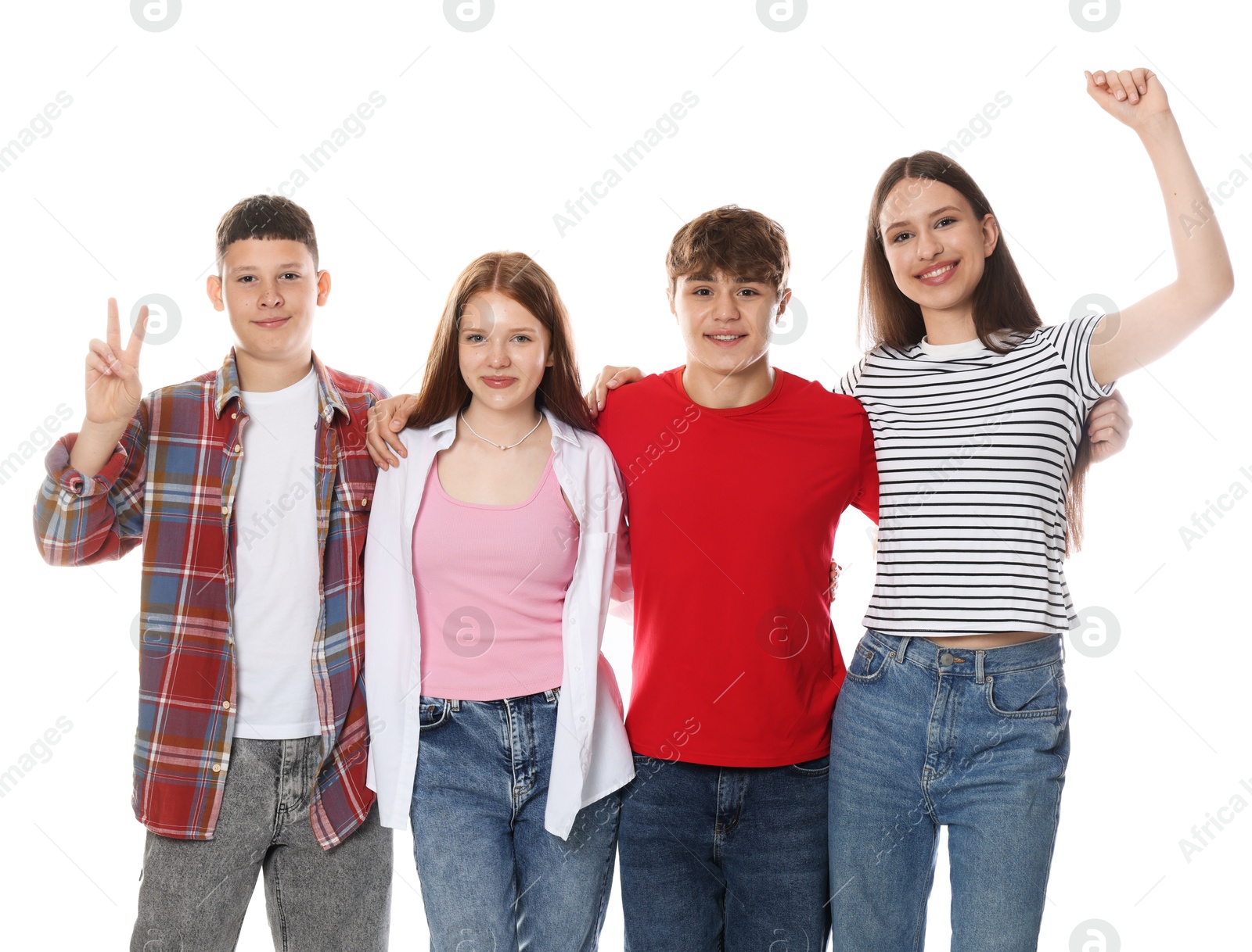Excited teenagers posing together on white background Photo of Excited teenagers posing together on white background