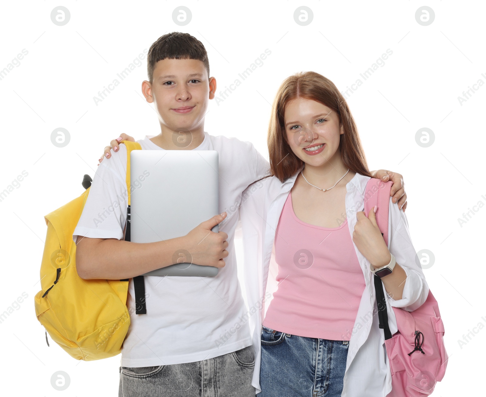 Teenage girl and boy with backpacks and laptop on white background Photo of Teenage girl and boy with backpacks and laptop on white background