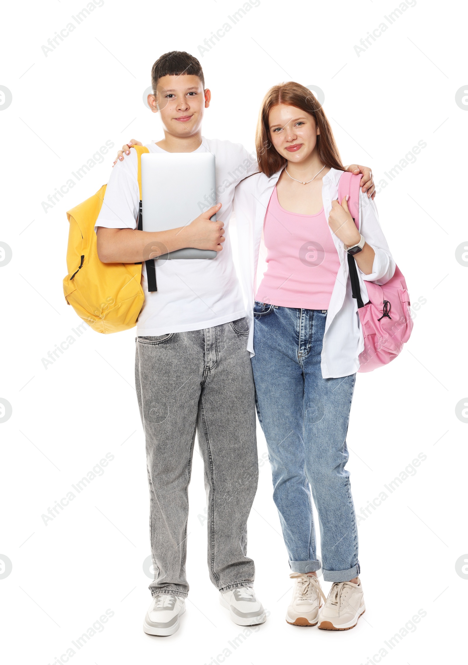 Photo of Teenage girl and boy with backpacks and laptop on white background