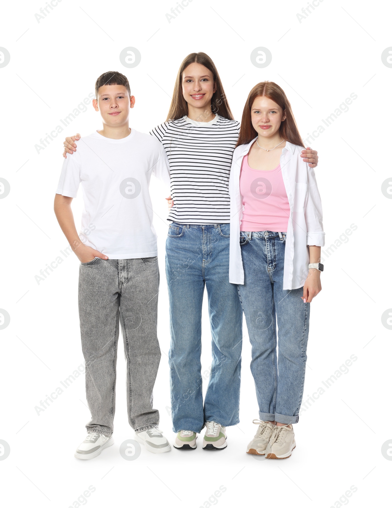 Happy teenagers posing together on white background Photo of Happy teenagers posing together on white background