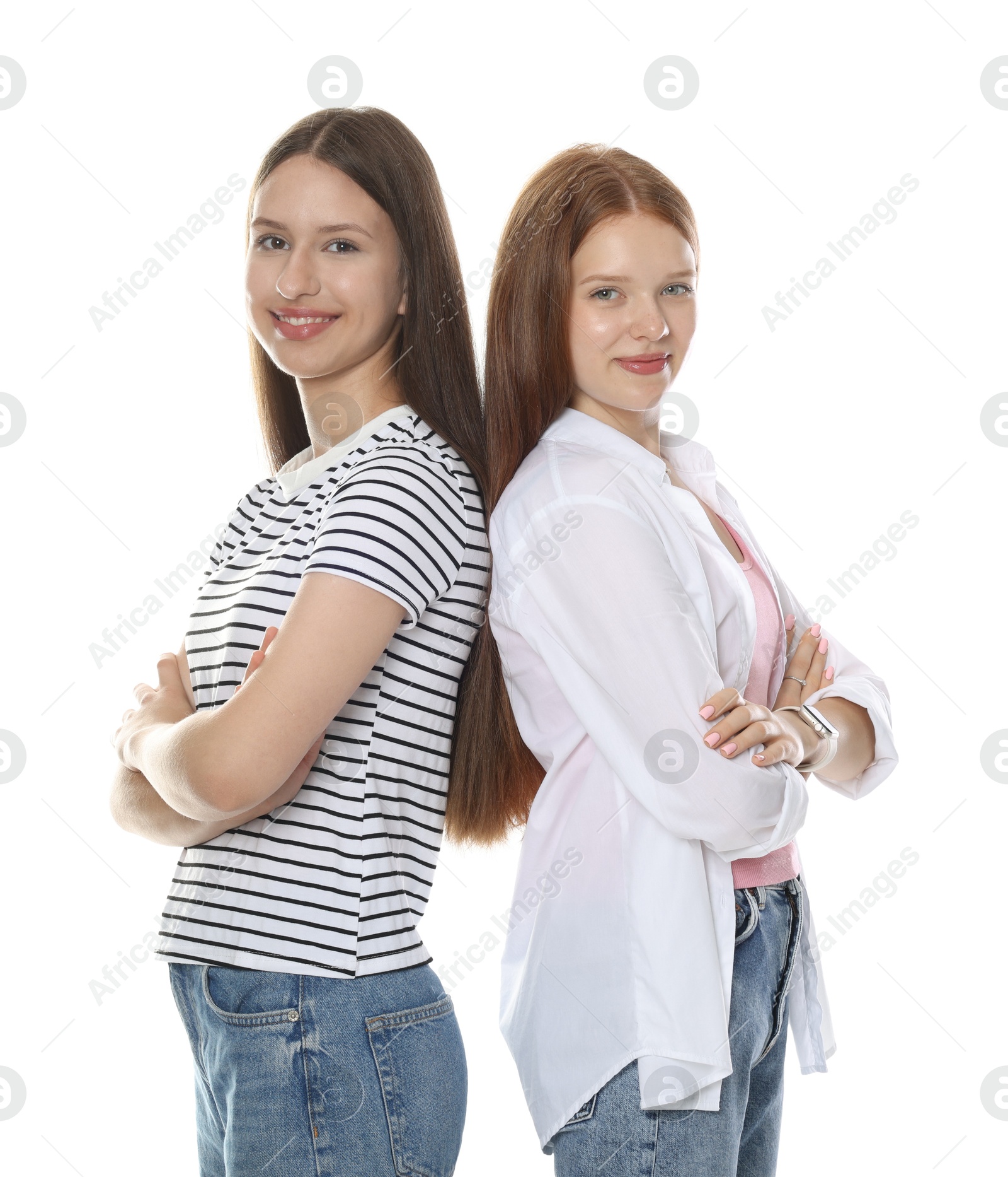 Cute teenage girls posing together on white background Photo of Cute teenage girls posing together on white background