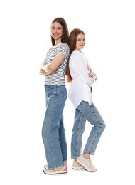 Photo of Cute teenage girls posing together on white background