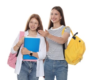 Photo of Teenage girl showing her friend something on white background