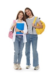 Photo of Teenage girls with backpacks and notebooks on white background