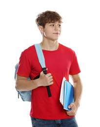 Photo of Happy teenage boy with backpack and notebooks on white background