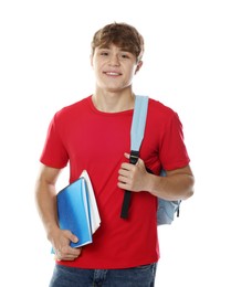 Photo of Happy teenage boy with backpack and notebooks on white background