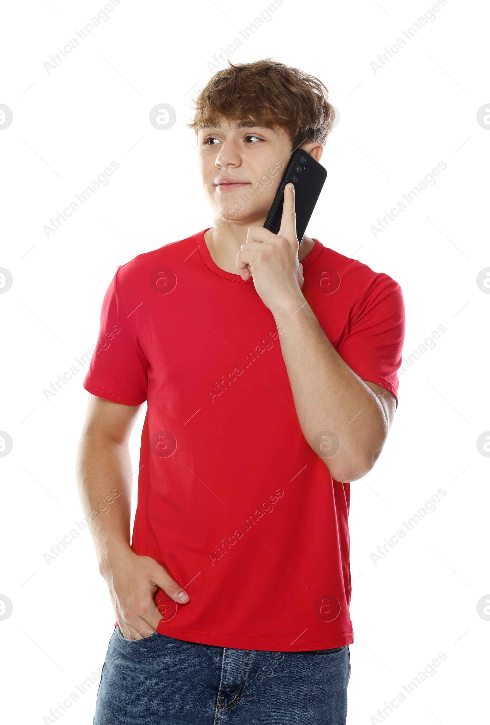Teenage boy having call via phone on white background Photo of Teenage boy having call via phone on white background