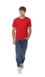 Photo of Happy teenage boy posing on white background