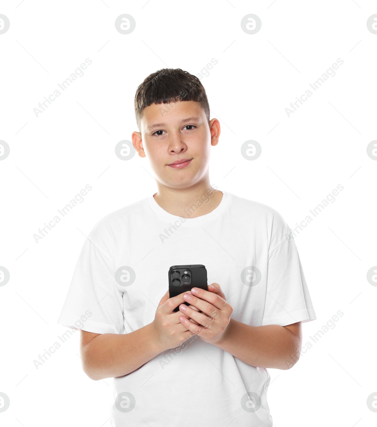 Teenage boy with smartphone on white background Photo of Teenage boy with smartphone on white background