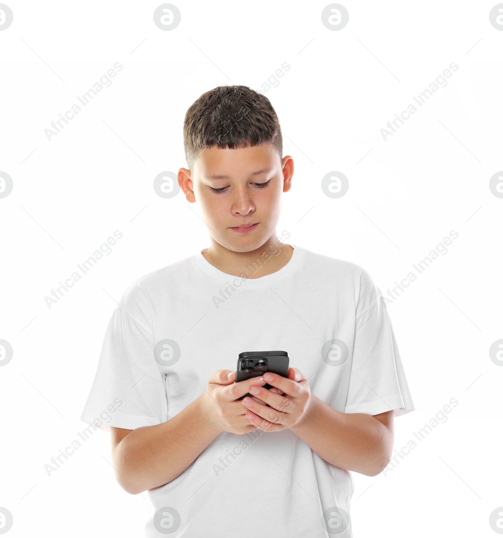 Teenage boy with smartphone on white background Photo of Teenage boy with smartphone on white background