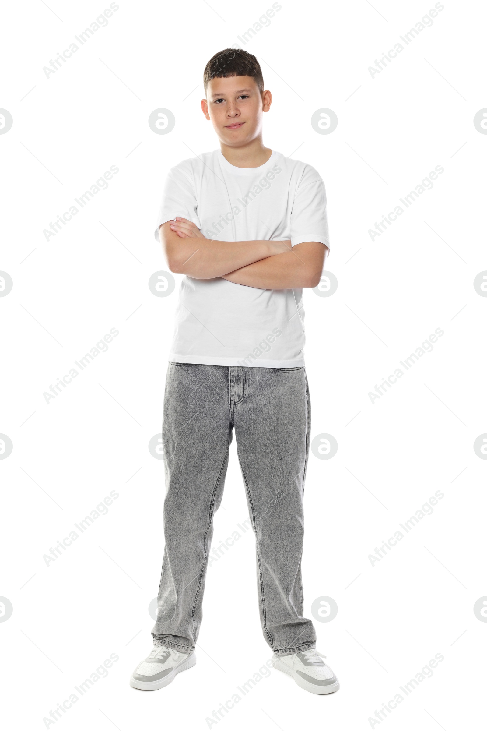 Happy teenage boy posing on white background Photo of Happy teenage boy posing on white background