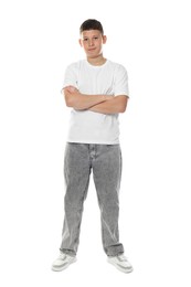 Photo of Happy teenage boy posing on white background