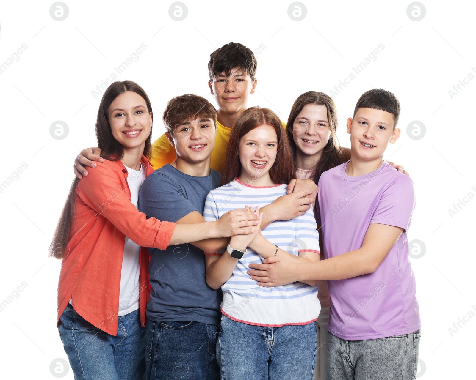 Group of happy teenagers posing on white background Photo of Group of happy teenagers posing on white background