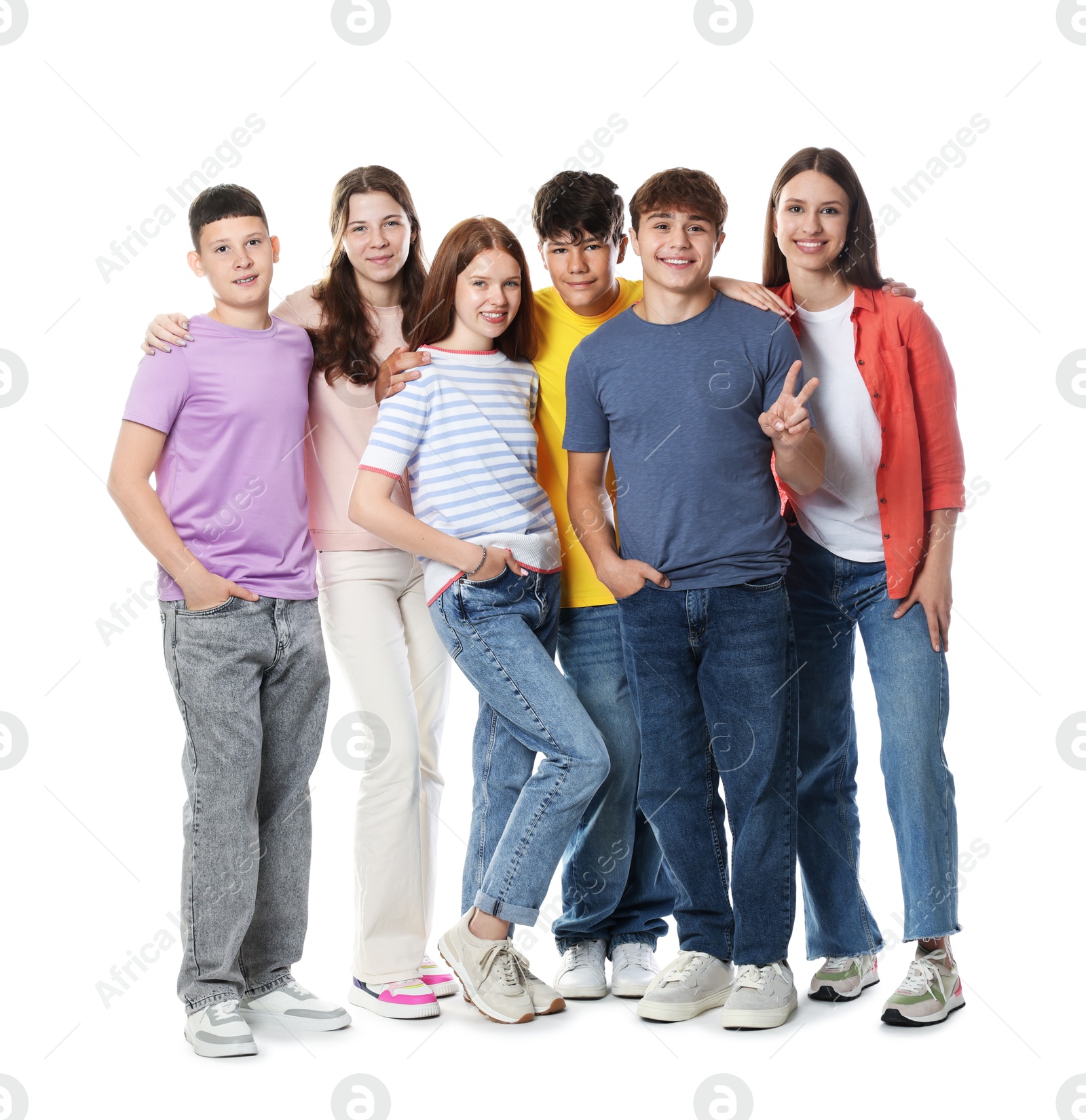 Group of happy teenagers posing on white background Photo of Group of happy teenagers posing on white background