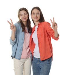Photo of Happy teenage girls posing on white background