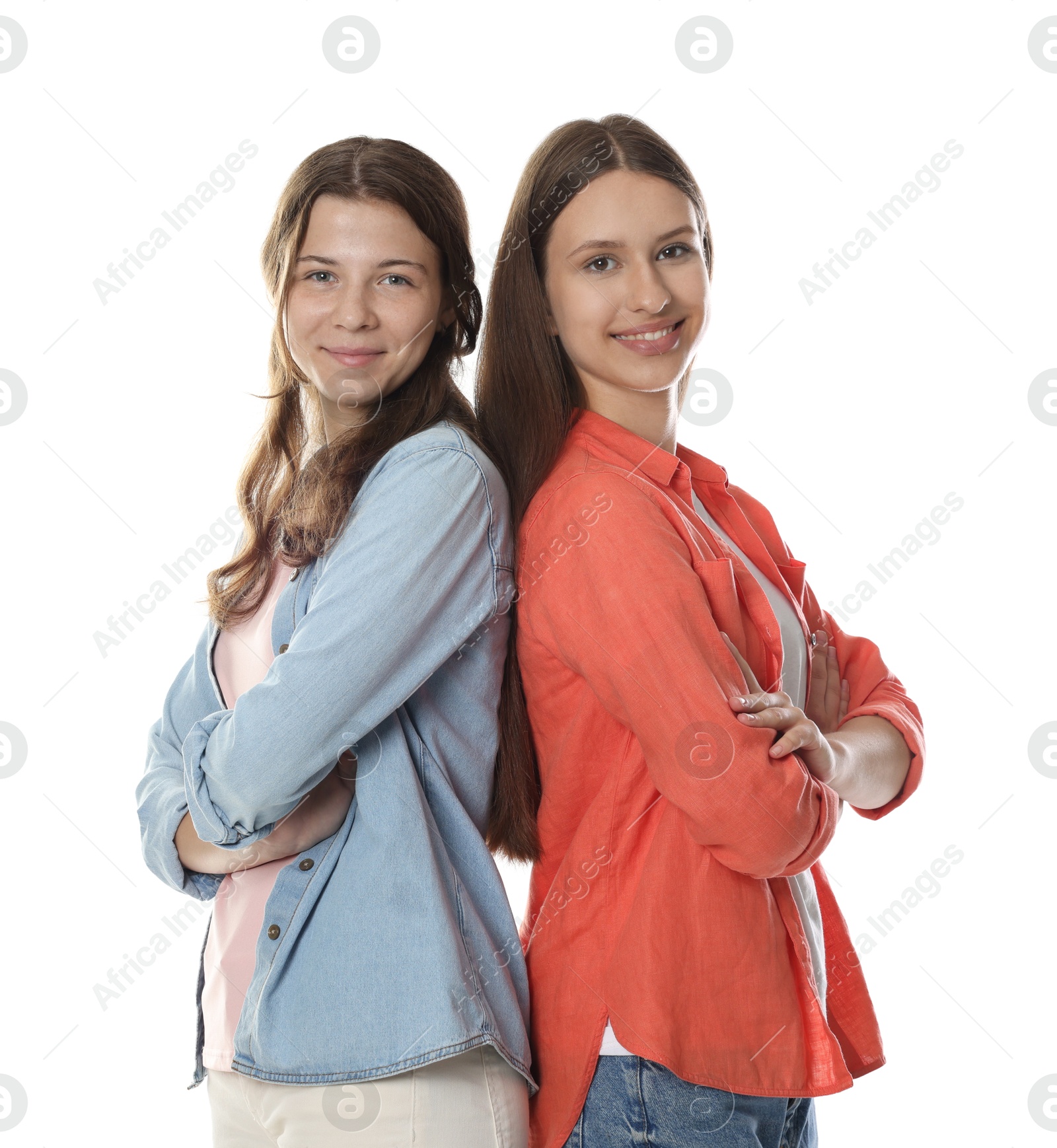 Happy teenage girls posing on white background Photo of Happy teenage girls posing on white background
