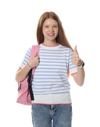 Photo of Happy teenage girl with backpack showing thumbs up on white background