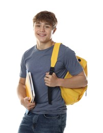 Photo of Cute teenage boy with backpack and notebooks on white background
