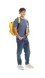 Photo of Cute teenage boy with backpack and notebooks on white background