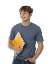 Photo of Cute teenage boy with notebooks on white background