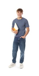 Photo of Cute teenage boy with notebooks on white background