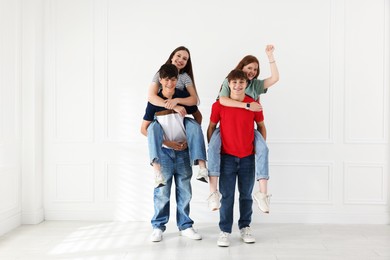 Photo of Group of teenagers having fun together indoors