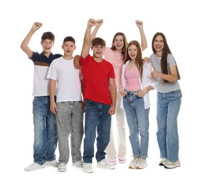 Photo of Group of excited teenagers posing on white background