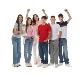 Photo of Group of excited teenagers posing on white background