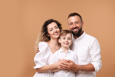 Photo of Portrait of happy family on beige background