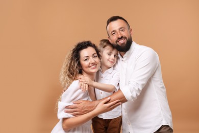 Photo of Portrait of happy family on beige background