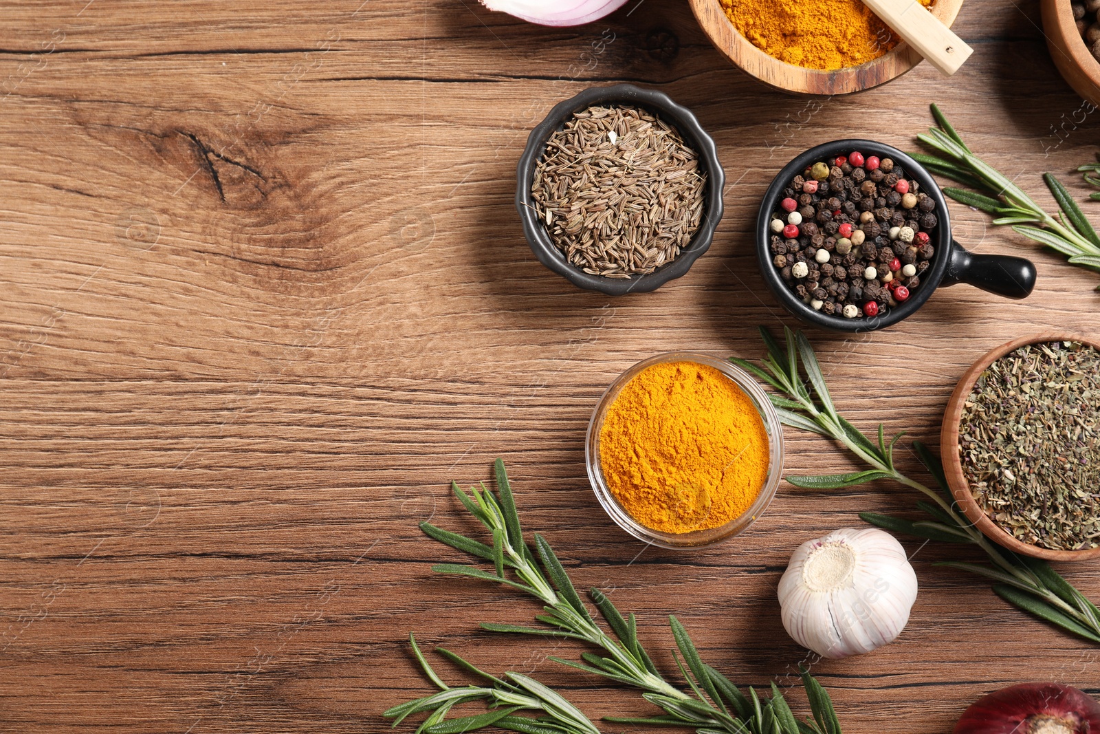 Different aromatic spices on wooden table, flat lay. Space for text Photo of Different aromatic spices on wooden table, flat lay. Space for text