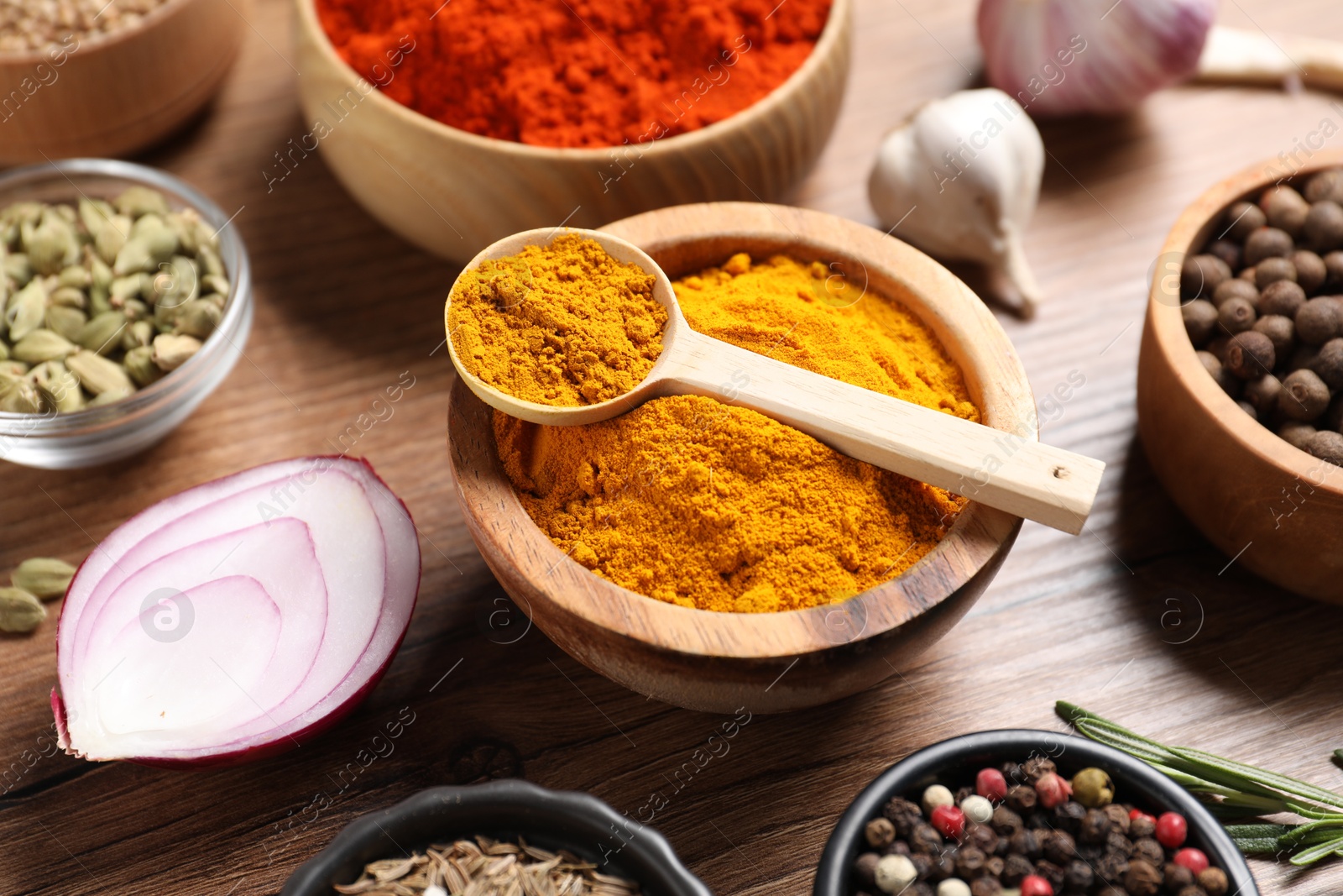Different aromatic spices on wooden table, closeup Photo of Different aromatic spices on wooden table, closeup