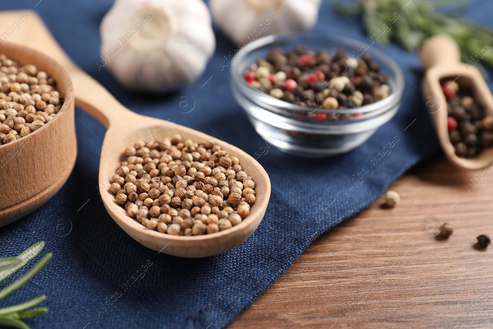 Different aromatic spices on wooden table, closeup Photo of Different aromatic spices on wooden table, closeup