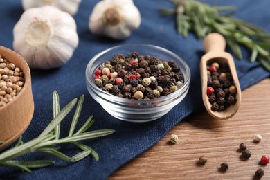 Photo of Different aromatic spices on wooden table, closeup