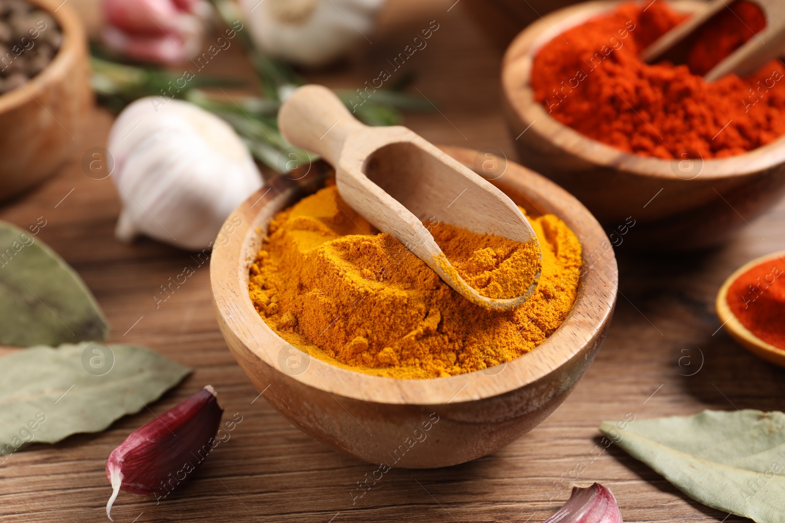 Different aromatic spices on wooden table, closeup Photo of Different aromatic spices on wooden table, closeup