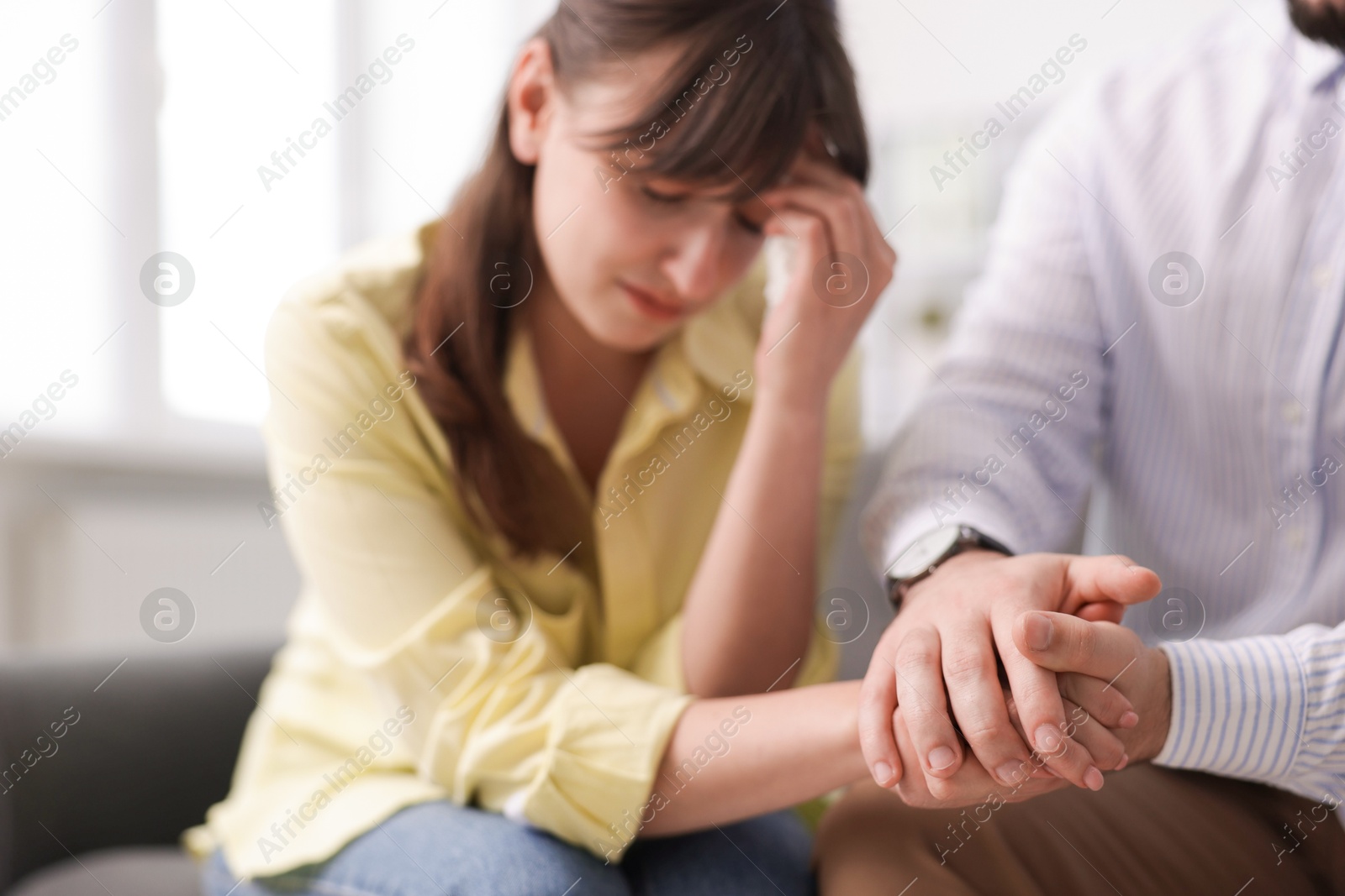Psychologist supporting patient during therapy session in office, selective focus Photo of Psychologist supporting patient during therapy session in office, selective focus