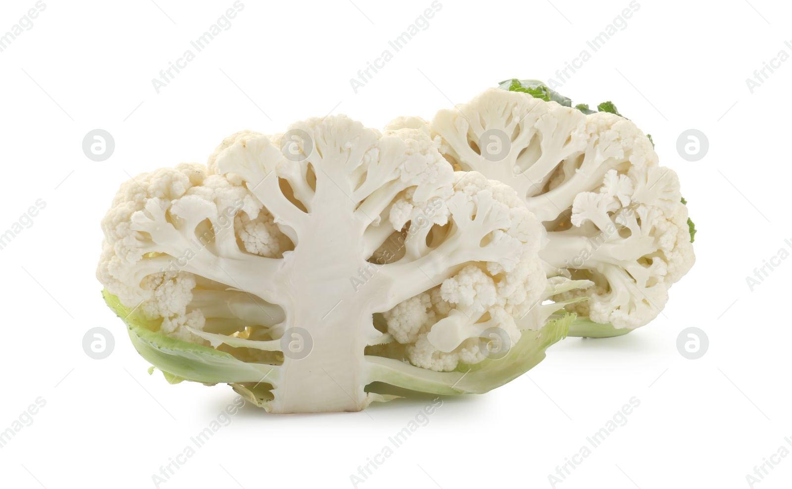 Halves of ripe cauliflower isolated on white Photo of Halves of ripe cauliflower isolated on white