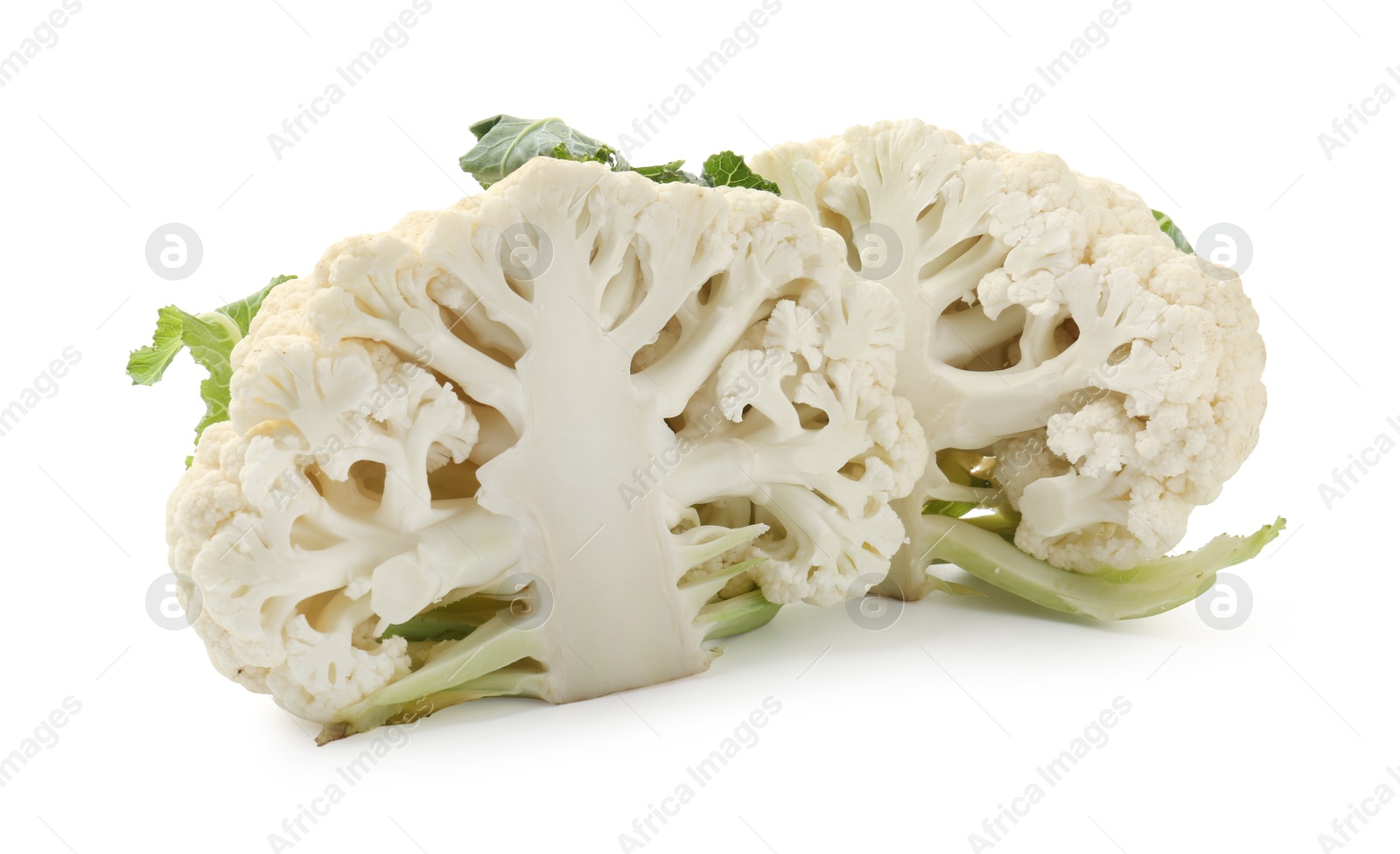 Halves of ripe cauliflower isolated on white Photo of Halves of ripe cauliflower isolated on white