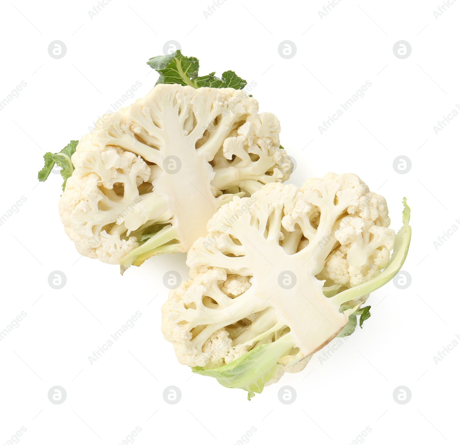 Halves of ripe cauliflower isolated on white Photo of Halves of ripe cauliflower isolated on white