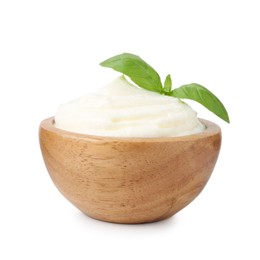 Photo of Delicious yogurt with basil in bowl isolated on white