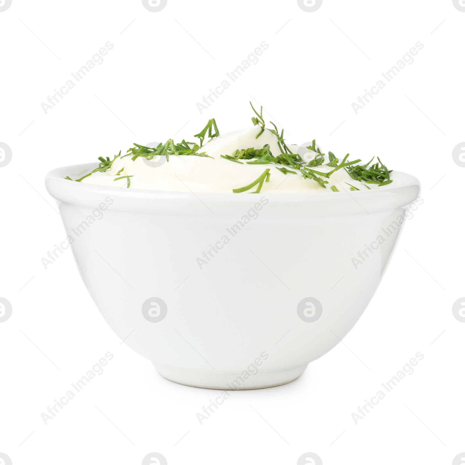 Delicious yogurt with dill in bowl isolated on white Photo of Delicious yogurt with dill in bowl isolated on white