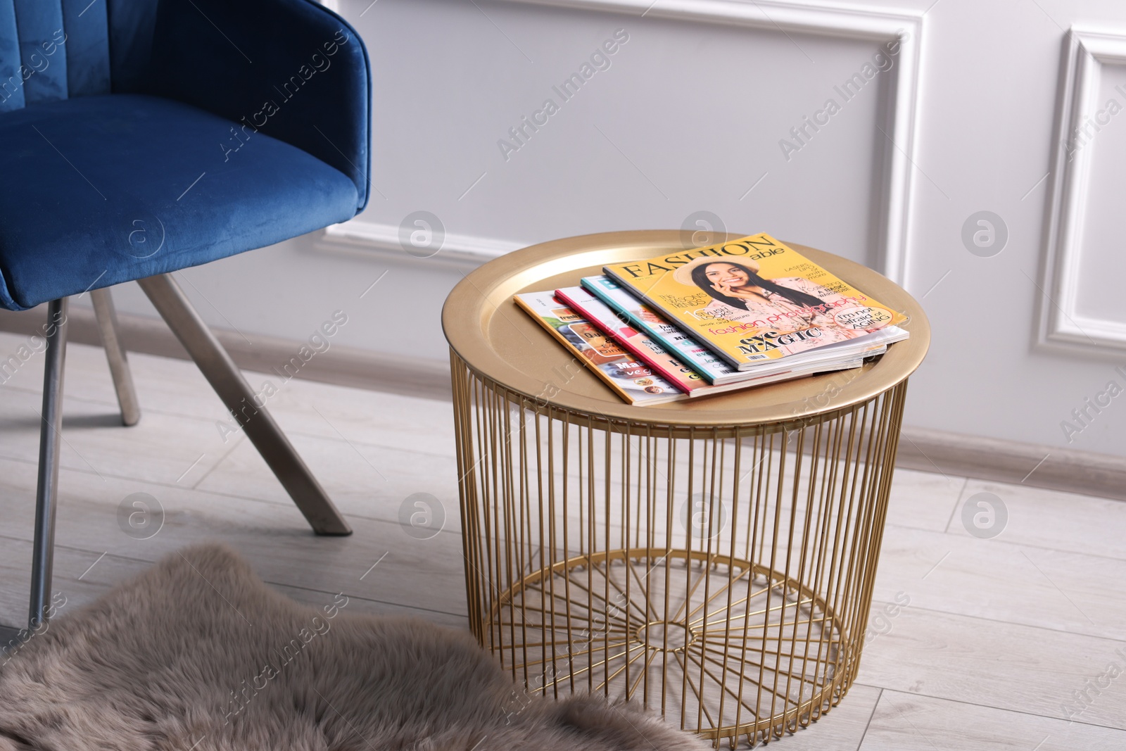 Many different trendy magazines on table indoors Photo of Many different trendy magazines on table indoors