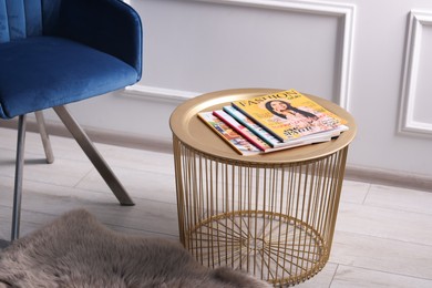 Photo of Many different trendy magazines on table indoors