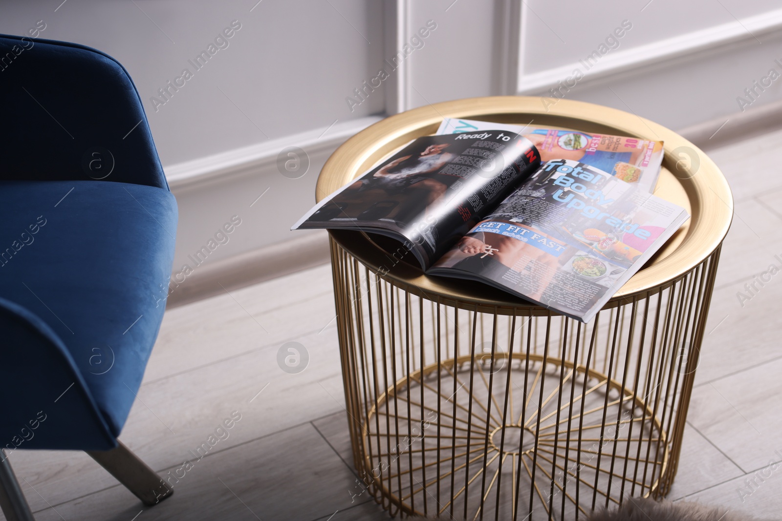 Different trendy magazines on table at home Photo of Different trendy magazines on table at home