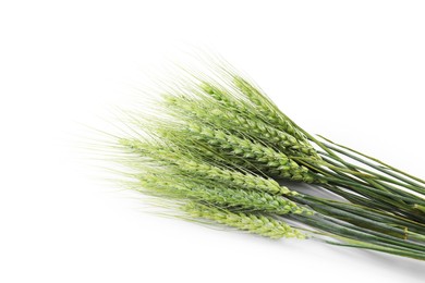 Photo of Many green wheat spikes isolated on white