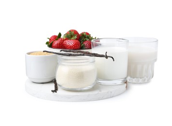 Photo of Different ingredients for panna cotta. Milk, sugar, vanilla and strawberries isolated on white