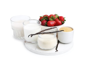 Photo of Different ingredients for panna cotta. Milk, sugar, vanilla and strawberries isolated on white