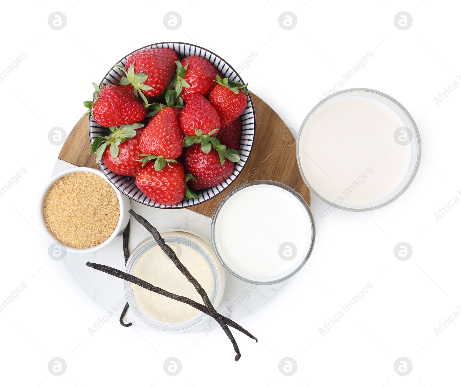 Photo of Different ingredients for panna cotta. Milk, sugar, vanilla and strawberries isolated on white, top view