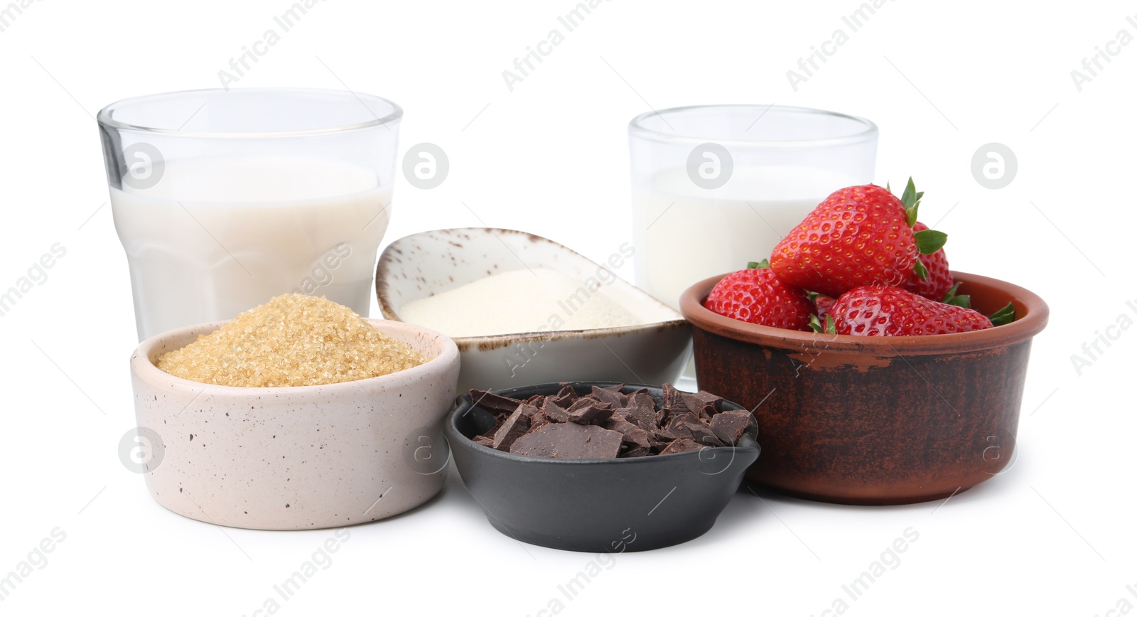 Different ingredients for panna cotta. Milk, sugar, vanilla, chocolate and strawberries isolated on white Photo of Different ingredients for panna cotta. Milk, sugar, vanilla, chocolate and strawberries isolated on white